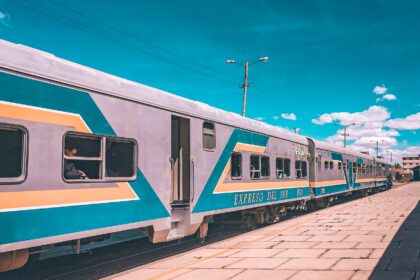 bolivia train a train riding off into the distance in bolivia, the sky is deep blue and the colors are warm